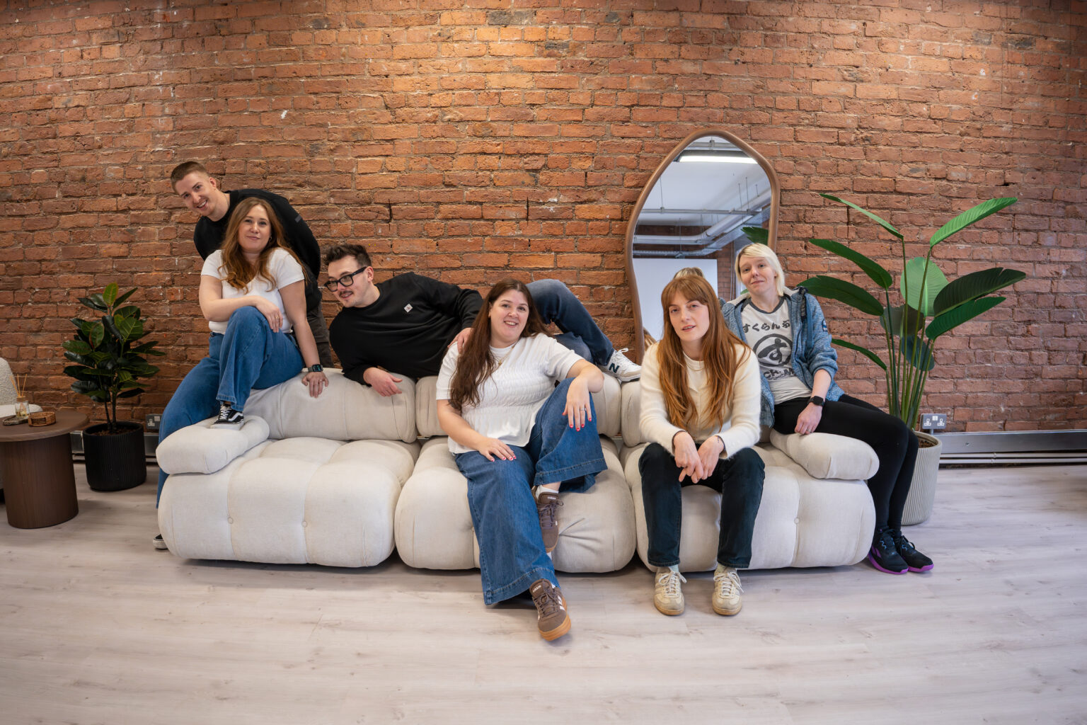 The Search Theory team relaxing on the sofa